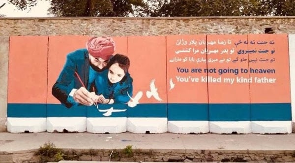 Days after a suicide bomb blast killed at least 19 persons, including 13 prominent Sikh leaders, in Jalalabad of Afghanistan on July 1, 2018 a group of local artists in Kabul paid tribute to the victims by painting a huge mural of one of them, Rawail Singh, with his daughter on the wall of the office of the Kabul Governor. (Express photo)